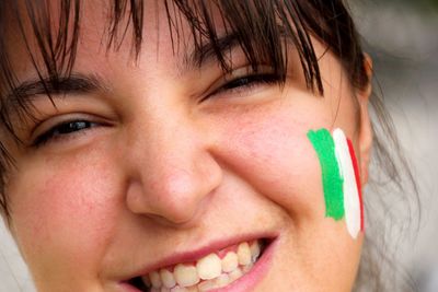 Close-up portrait of woman with face paint