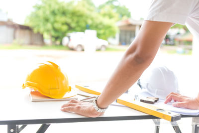 Midsection of woman working on table