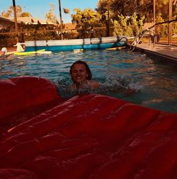 Young woman swimming in pool