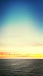 Scenic view of sea against sky at sunset