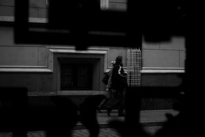 Woman standing in front of building