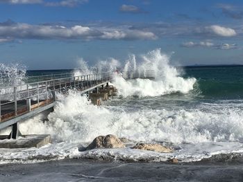 Waves breaking against sea