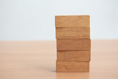 Close-up of wooden table against white background