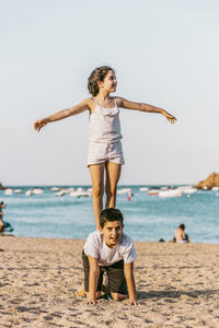 Full length of child playing on beach