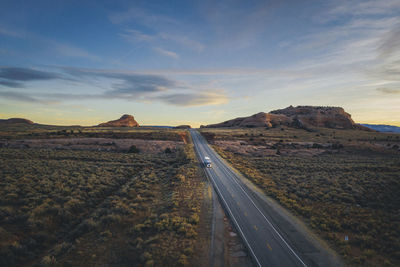 Lonely utah's road in the evening with a truck from above