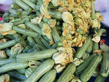 High angle view of zucchinis for sale at market stall