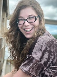 Portrait of smiling young woman wearing braces