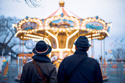 Rear view of people at amusement park