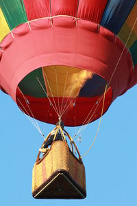 Hot air balloon in flight with flame