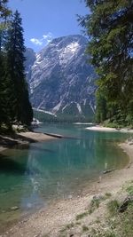 Scenic view of lake and mountains against sky