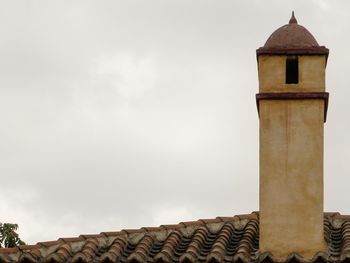 High section of built structure against sky