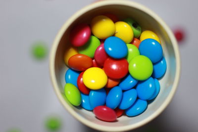 Close-up of multi colored candies in bowl