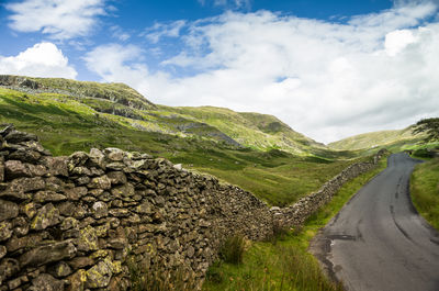 Scenic view of mountain road against sky