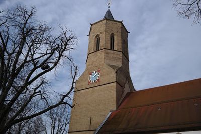 Low angle view of clock tower against sky