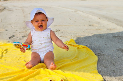 Full length of baby at beach