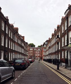 Street in city against sky