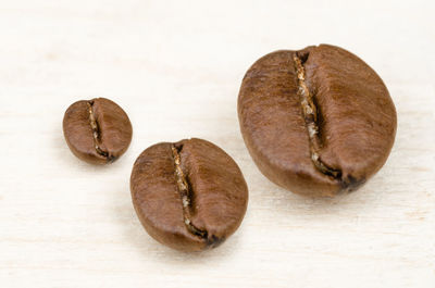 Close-up of fruits on table against white background