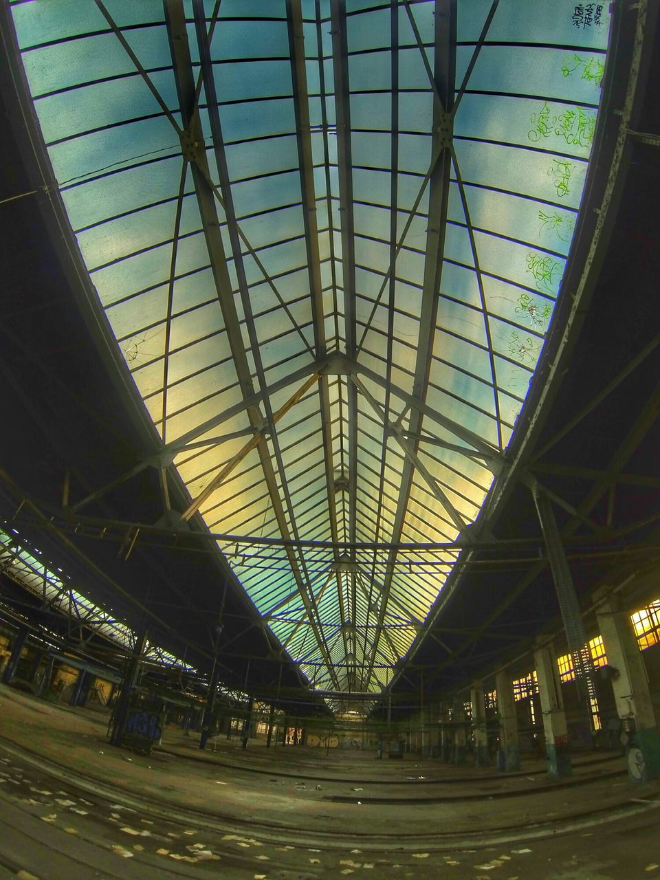 architecture, built structure, indoors, ceiling, low angle view, transportation, modern, glass - material, railroad station, connection, illuminated, architectural feature, interior, sky, metal, diminishing perspective, engineering, no people, skylight, travel