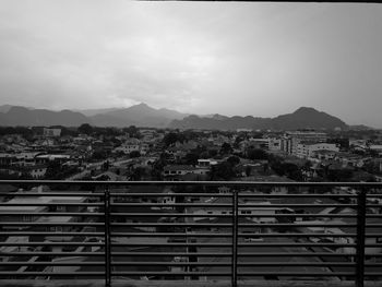 Cityscape against cloudy sky