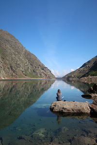 Scenic view of lake against blue sky