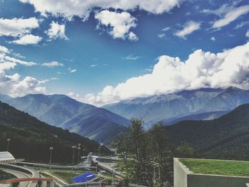 Scenic view of mountains against cloudy sky