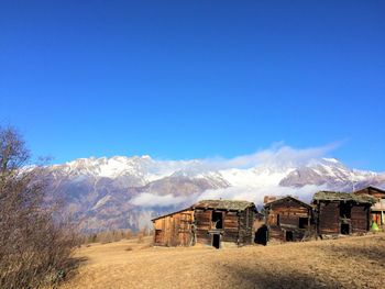 View of desert against clear blue sky