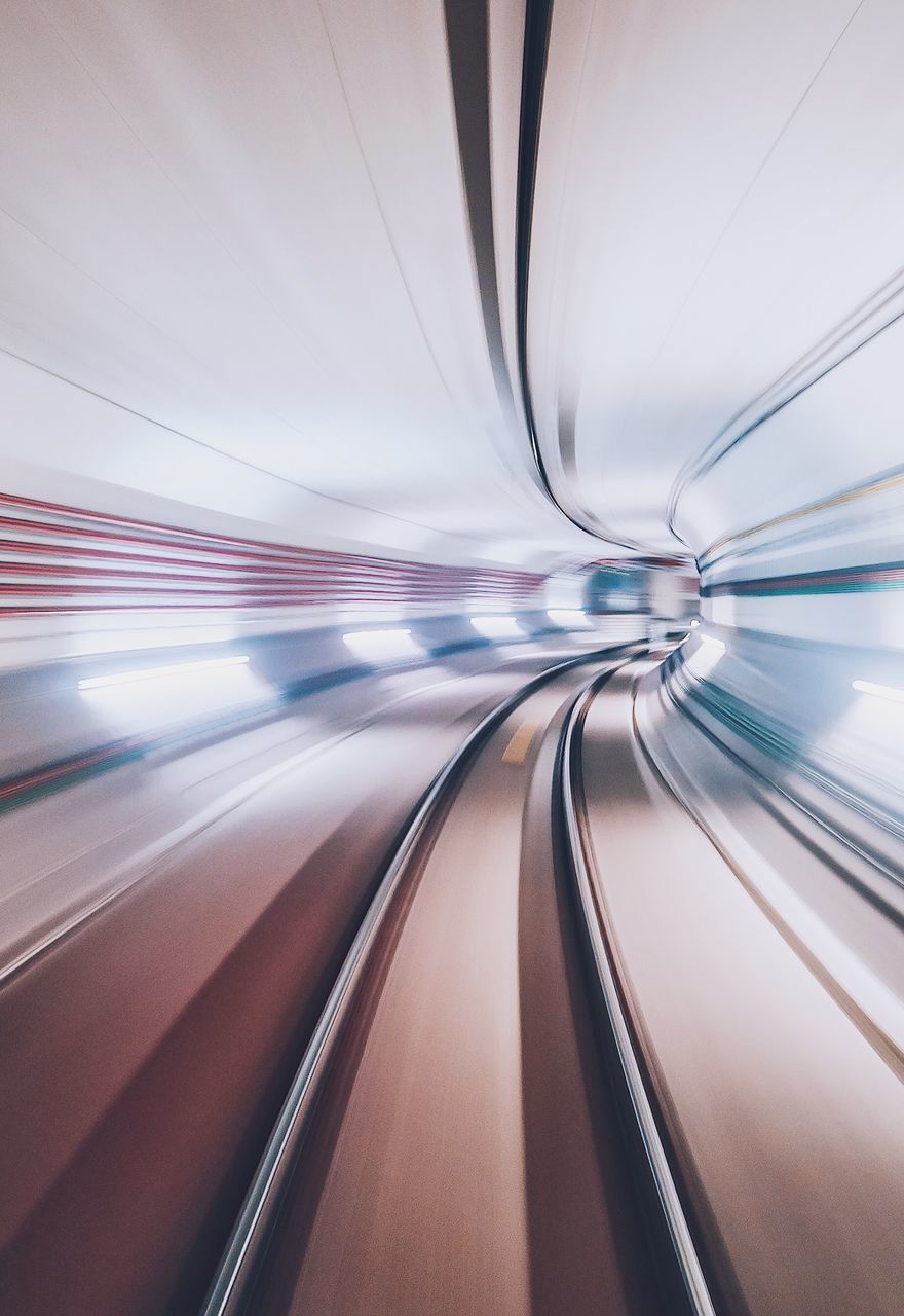 transportation, blurred motion, motion, architecture, speed, the way forward, no people, indoors, public transportation, mode of transportation, direction, tunnel, illuminated, on the move, diminishing perspective, long exposure, rail transportation, technology, built structure, connection, track, moving walkway