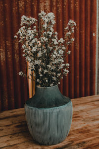 Close-up of flower vase on table