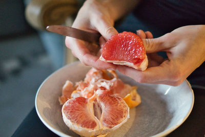 Close-up of hand holding ice cream