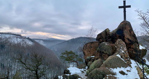 Scenic view of snowcapped mountains against sky during winter