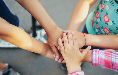 Low section of woman holding hands