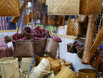Clothes hanging in basket for sale at market