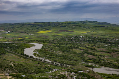 High angle view of agricultural landscape against sky