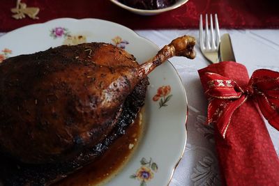 High angle view of roasted meat in plate on table