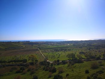 Scenic view of landscape against clear blue sky