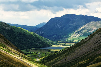 Scenic view of landscape and mountains against sky