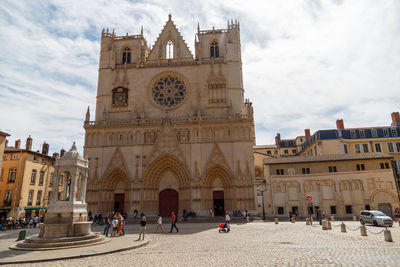 Group of people in front of historic building