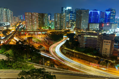 High angle view of illuminated buildings in city at night