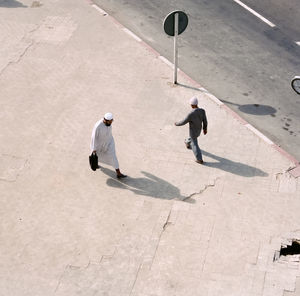 High angle view of men standing in city