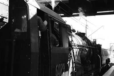 Train on railroad track against sky