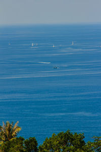 Scenic view of sea against blue sky