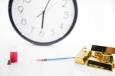 Close-up of clock on table