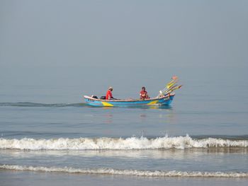 Boat in sea against sky