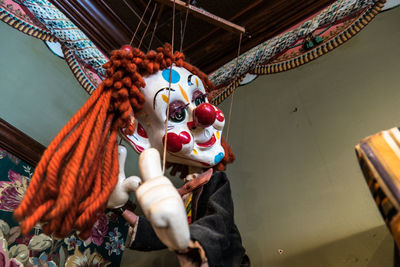 Low angle view of puppet indoors