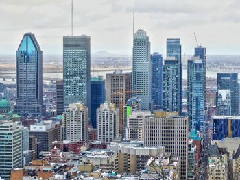 Modern buildings in city against sky