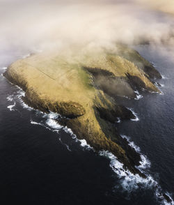 Aerial view of island during sunset