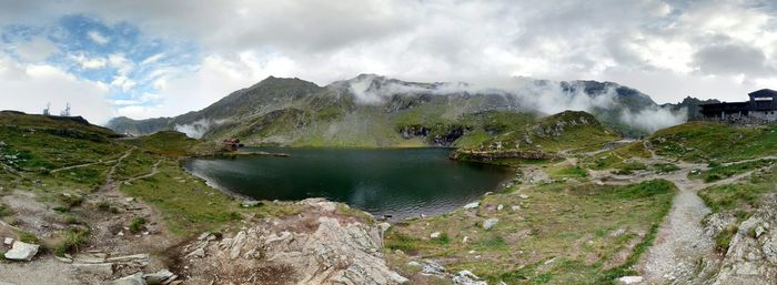 Scenic view of mountains against cloudy sky