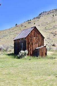 View of house on field against clear sky