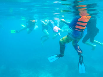 People swimming in sea