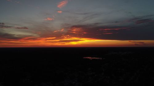 Scenic view of dramatic sky over sea during sunset